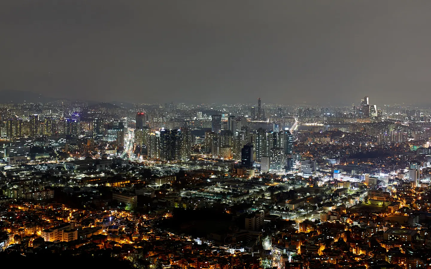 Wide night view of Seoul illuminated during winter.